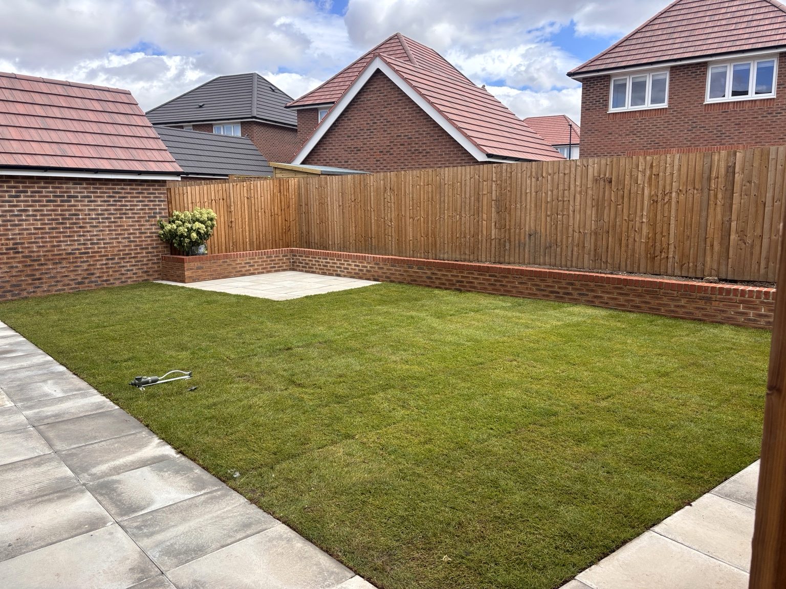greenman lawn brick retaining wall